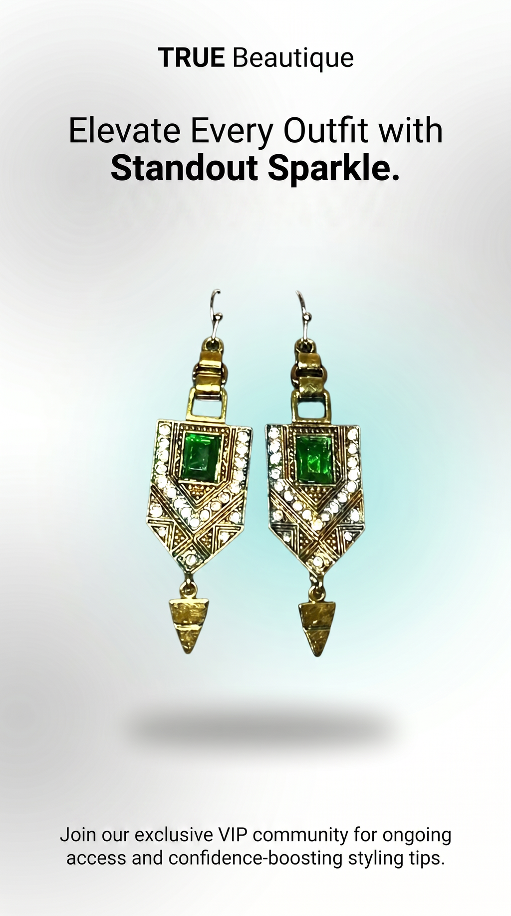 A pair of gold-toned statement dangle earrings with green rectangular stones and clear rhinestone-like accents, shown against a light gray gradient background with promotional text above and below.